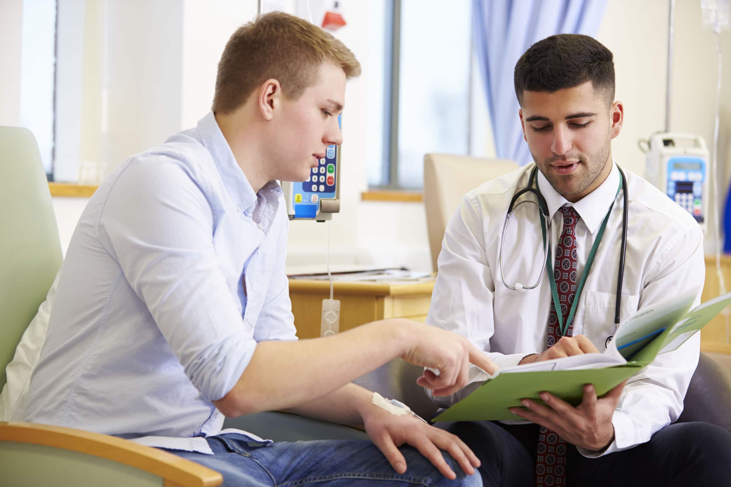 A doctor discussing medical records with a patient in a hospital