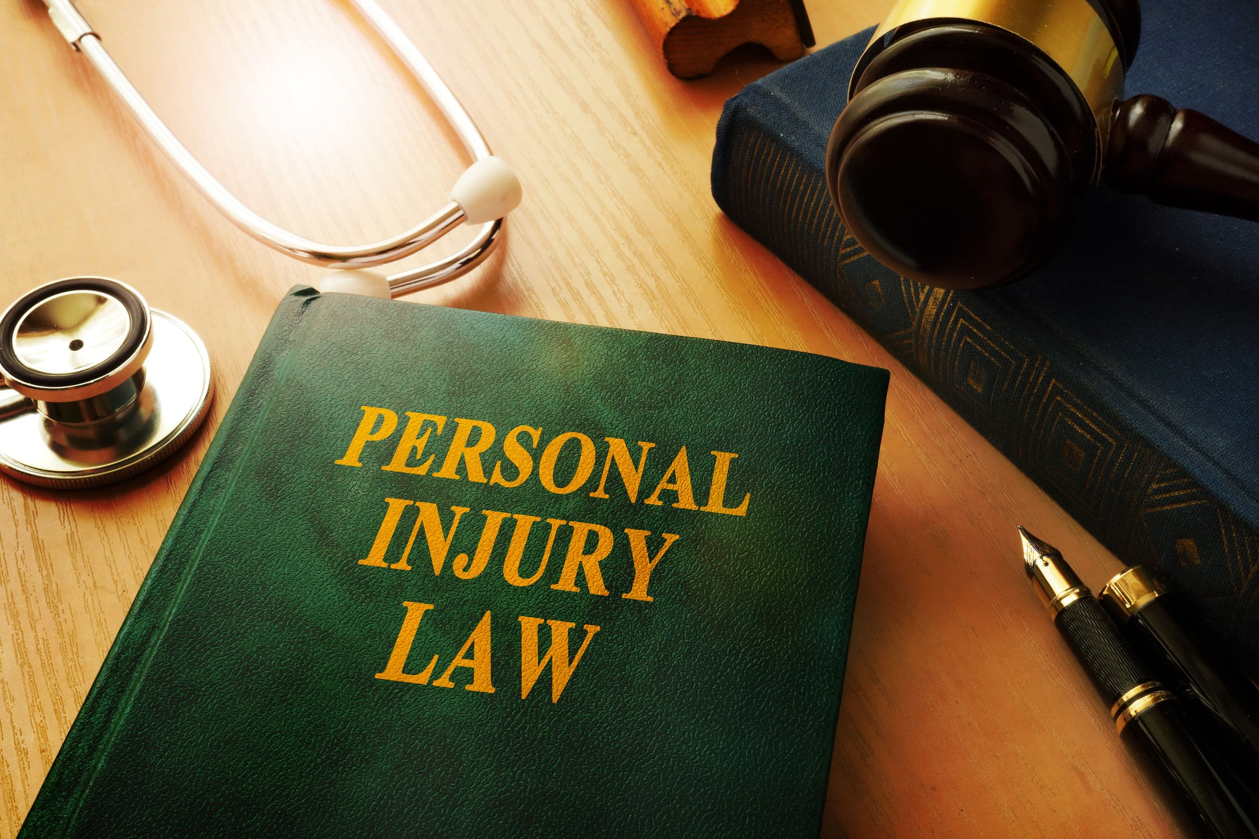 Personal Injury Law book with stethoscope.