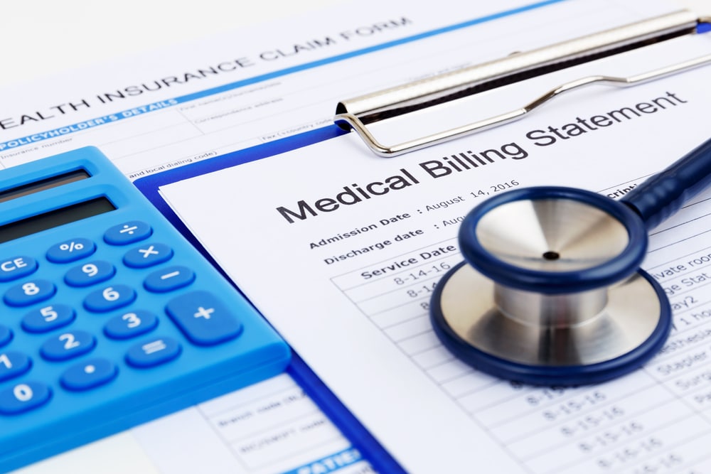 Doctor reviewing medical bill with patient
