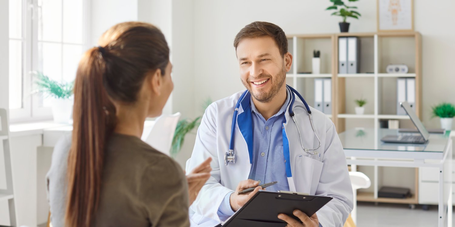 New York accident doctor consulting with a patient in a bright medical office